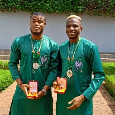 Tinubu Awards MON to each Super Eagles Player, gifts them flats & plot of lands